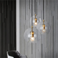 Suspension verre gris fumé 20 cm dans salon loft chaleureux