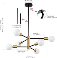 Lustre 10 branches noir au-dessus d'un canapé scandinave