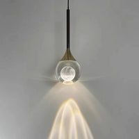 Suspension luxe créative G9, vue d'ensemble du luminaire allumé jeu de lumière naturel