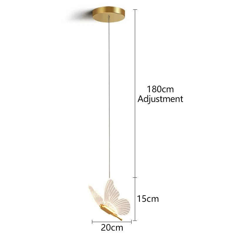 Vue trois quarts de la suspension papillon en finition métal doré