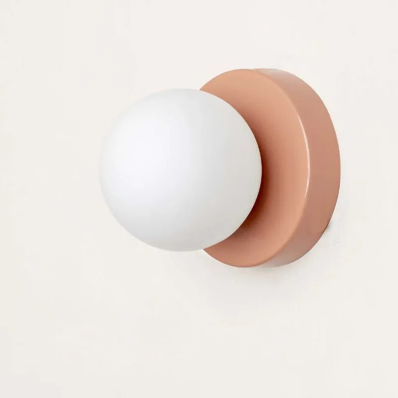 Applique macaron mini verte 12 cm dans un salon contemporain