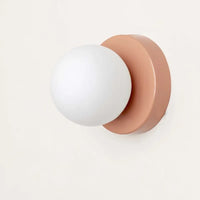 Applique macaron mini verte 12 cm dans un salon contemporain