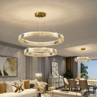 Lustre cristal LED doré double cercle dans une salle à manger