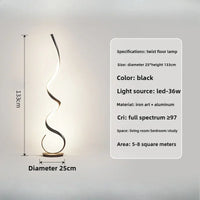 Lampadaire scandinave LED blanc à côté d'un fauteuil design