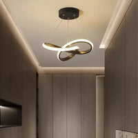 Suspension LED ronde noire 24 cm dans un couloir scandinave