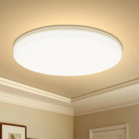 Plafonnier LED rond, installé en chambre cosy ambiance chaleureuse