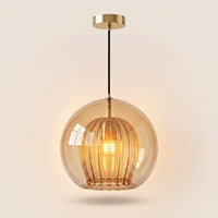 Suspension Carat verre ambré allumée, ampoule Edison lumière chaude