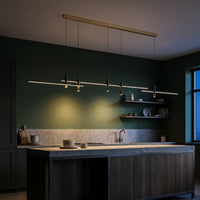 Suspension Fil coloris noir, en lueur sur un mur profond, allumée