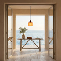 Suspension Laque coloris orange mat 1, dans une villa avec vue sur la mer, allumée